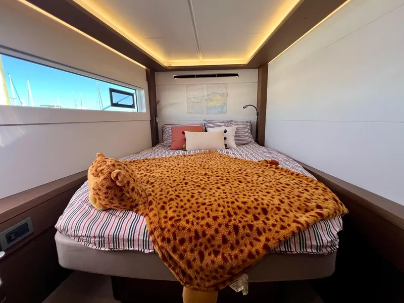 Slide: The Image of Cozy bedroom in 2022 Lagoon 46 yacht with plush cheetah blanket. - 33