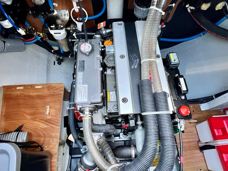 Slide: The Image of Engine compartment of a 2022 Lagoon 46 catamaran, showcasing detailed mechanical components. - 35