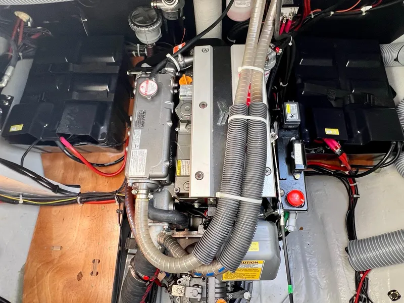 Slide: The Image of Engine compartment of a 2022 Lagoon 46 catamaran, showcasing detailed mechanical components. - 36