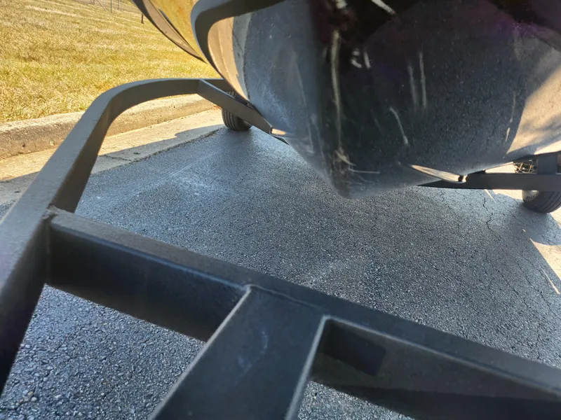 Slide: The Image of 2021 Tahoe T16 boat on trailer, close-up view of hull and trailer frame. - 7