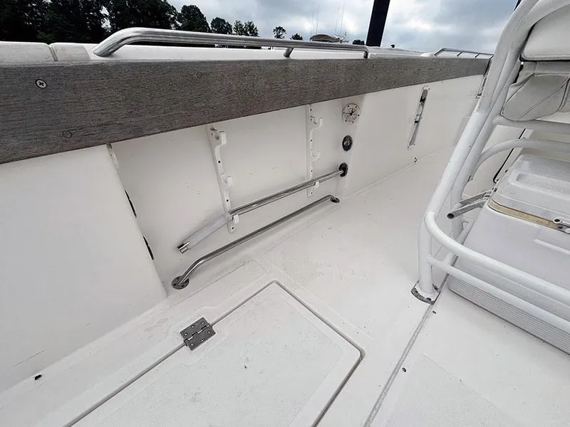 Slide: The Image of 2003 Marlago FS35 boat interior with white seating and stainless steel railings. - 17