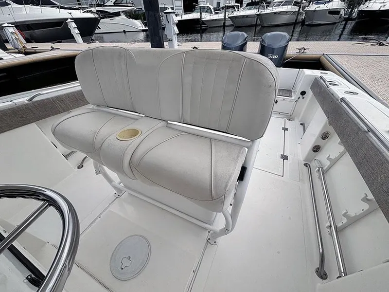 Slide: The Image of 2003 Marlago FS35 boat interior with cushioned seating and steering wheel. - 18