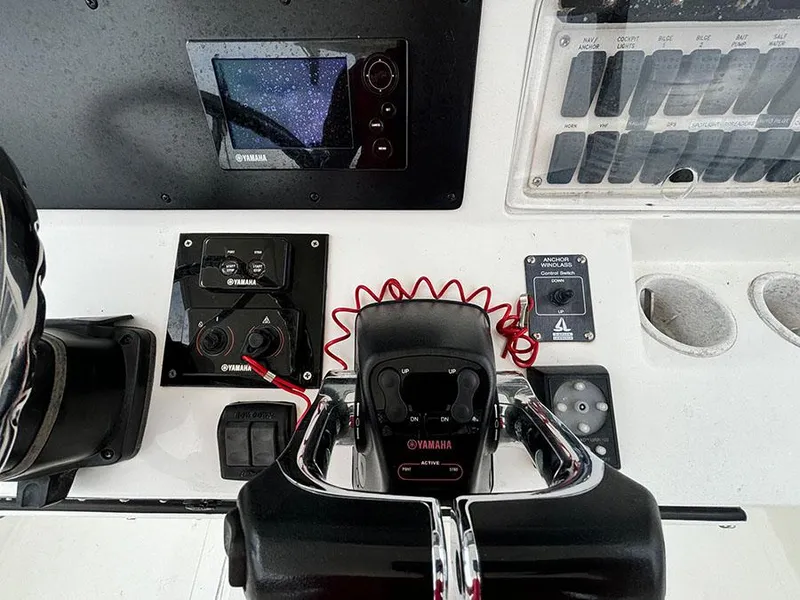 Slide: The Image of Control panel of a 2003 Marlago FS35 boat with Yamaha equipment. - 23