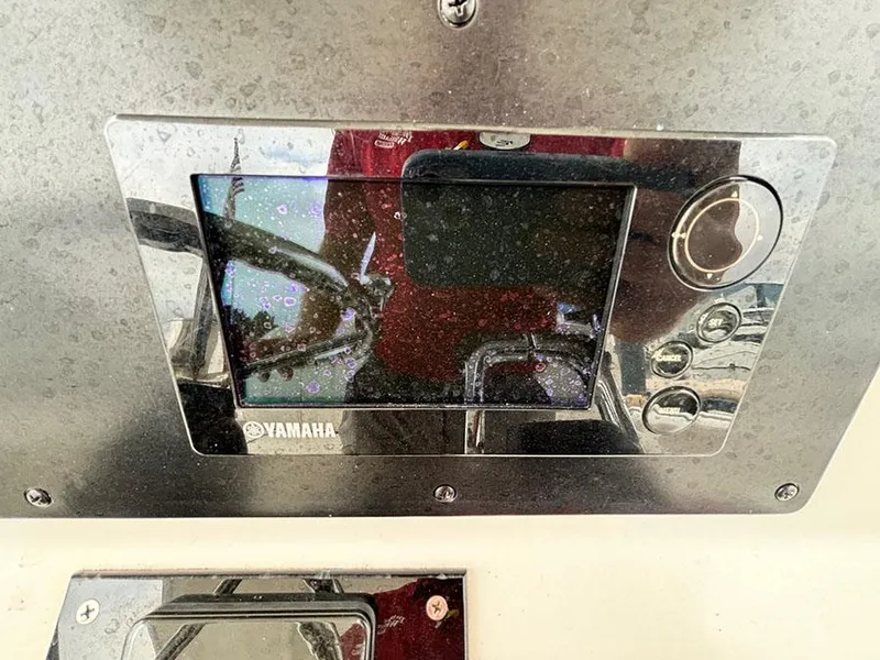 Slide: The Image of Yamaha display panel on a 2003 Marlago FS35 boat dashboard. - 25