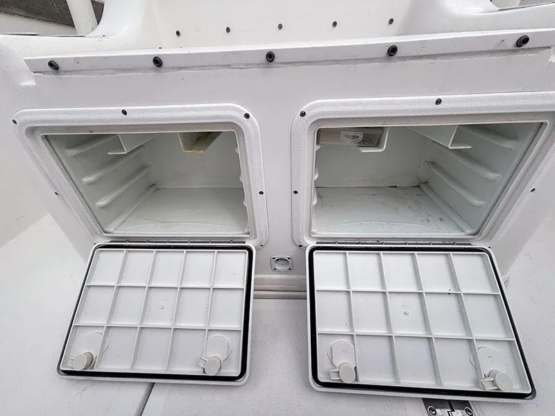 Slide: The Image of Open storage compartments on a 2003 Marlago FS35 boat, showcasing interior space. - 30