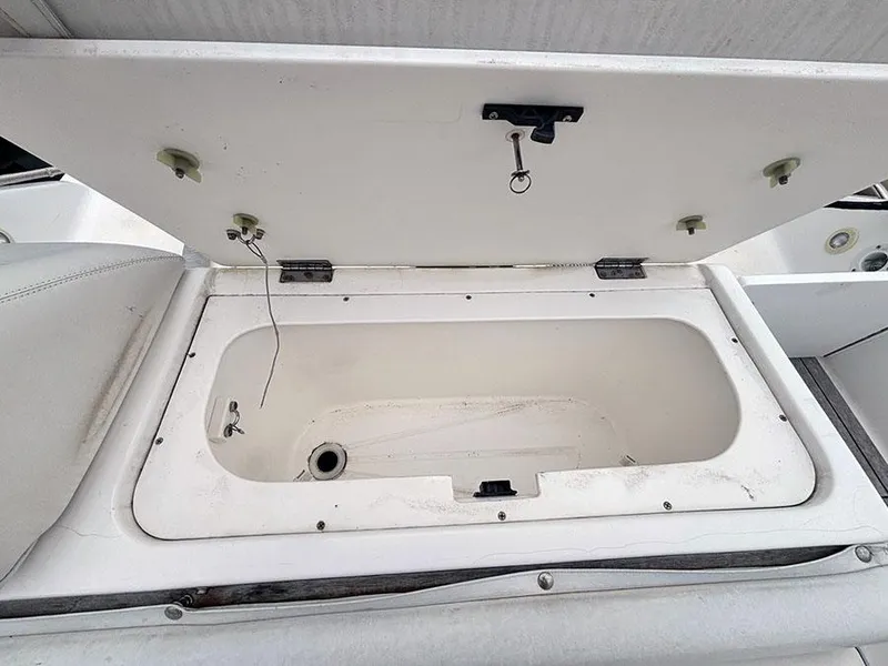 Slide: The Image of Open storage compartment on a 2003 Marlago FS35 boat. - 9