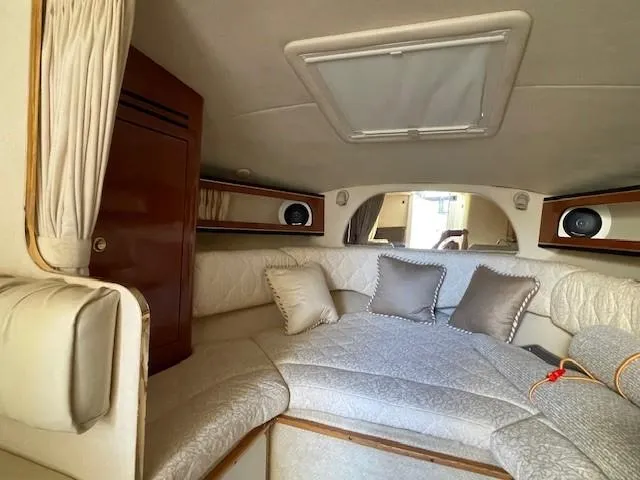 Slide: The Image of Luxurious interior of 2001 Sea Ray 280 Sundancer with plush seating and elegant decor. - 30
