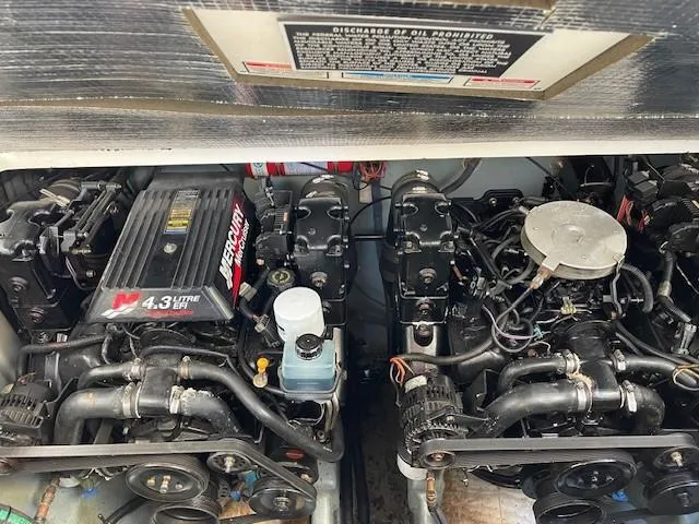 Slide: The Image of Engine compartment of 2001 Sea Ray 280 Sundancer with twin MerCruiser 4.3L engines. - 38