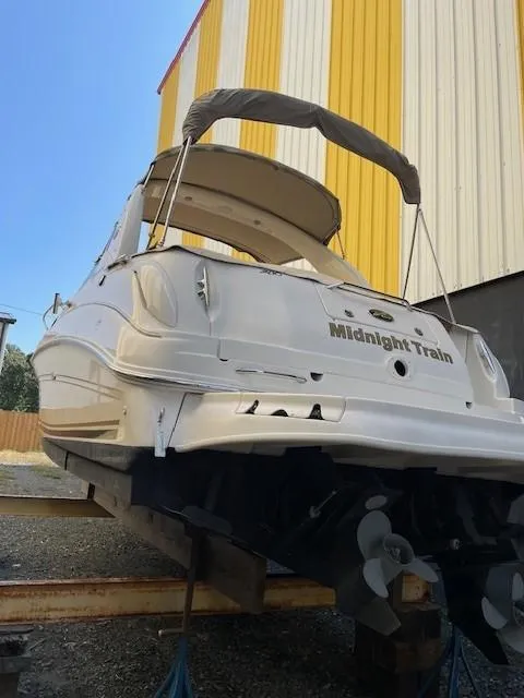 Slide: The Image of 2001 Sea Ray 280 Sundancer boat named "Midnight Train" on dry dock. - 4