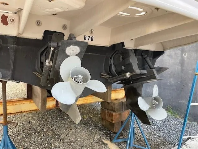 Slide: The Image of 2001 Sea Ray 280 Sundancer boat propellers on dry dock. - 5