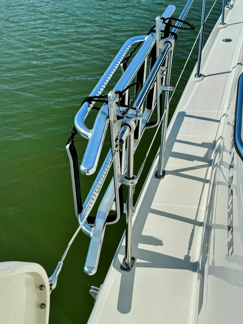 Slide: The Image of 2005 Sea Ray 390 Motor Yacht deck with stainless steel railing. - 13