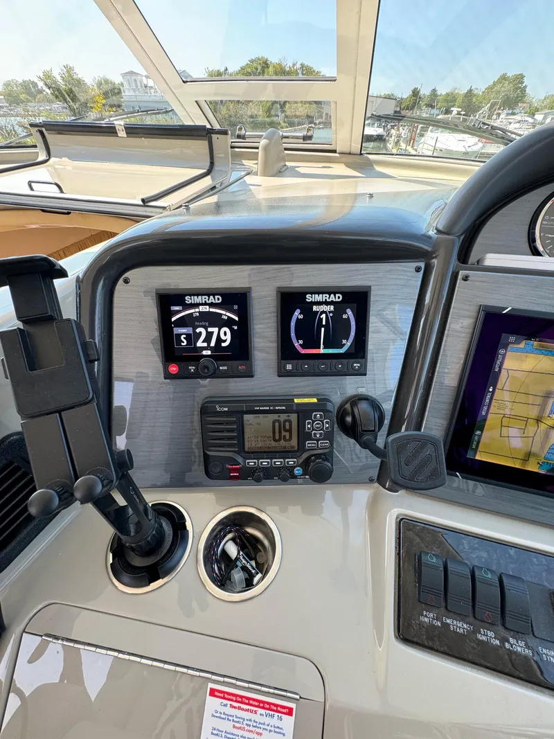 Slide: The Image of 2005 Sea Ray 390 Motor Yacht helm with Simrad displays and navigation equipment. - 19