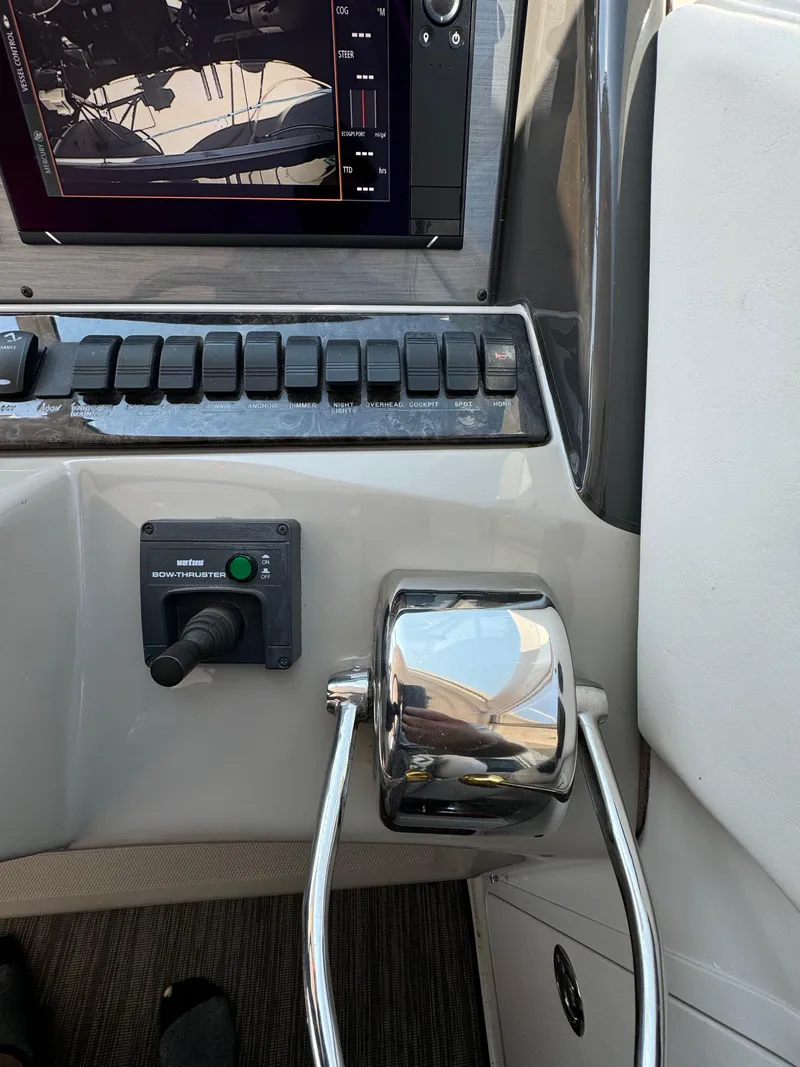 Slide: The Image of 2005 Sea Ray 390 Motor Yacht helm controls and navigation display. - 20