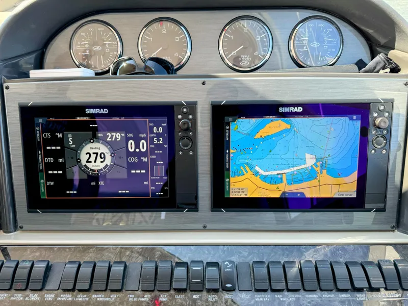 Slide: The Image of Dashboard of a 2005 Sea Ray 390 Motor Yacht with Simrad navigation displays. - 23