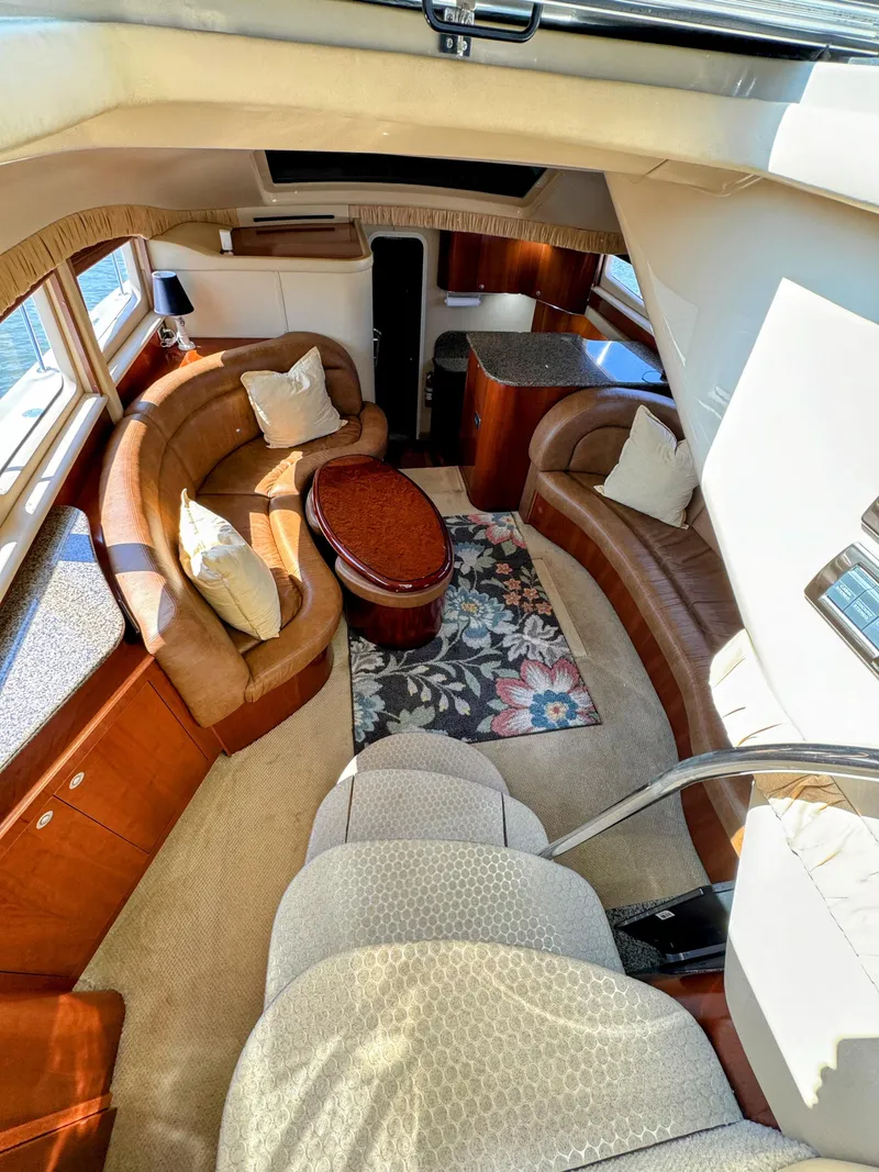 Slide: The Image of Luxurious interior of 2005 Sea Ray 390 Motor Yacht with plush seating and elegant decor. - 26