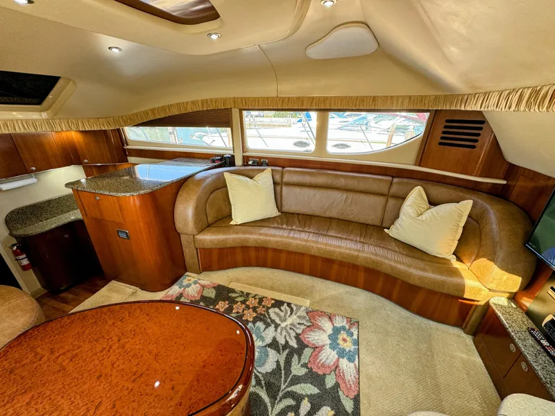 Slide: The Image of Luxurious interior of 2005 Sea Ray 390 Motor Yacht with leather seating and elegant wood finishes. - 27