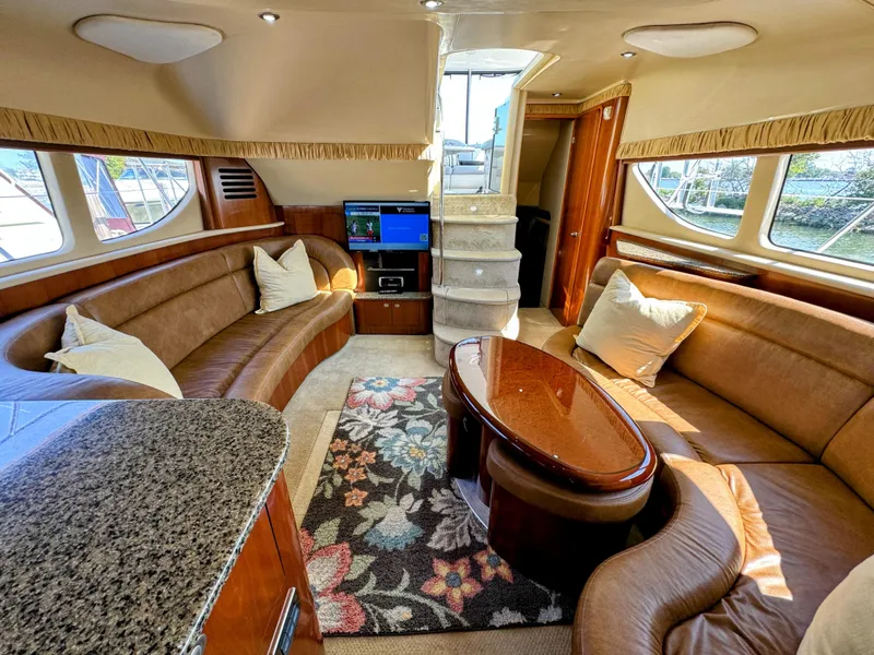 Slide: The Image of Luxurious interior of 2005 Sea Ray 390 Motor Yacht with plush seating and elegant decor. - 29