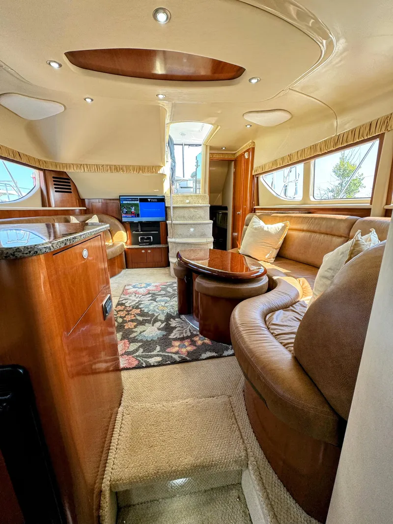 Slide: The Image of Luxurious interior of 2005 Sea Ray 390 Motor Yacht with plush seating and elegant decor. - 30