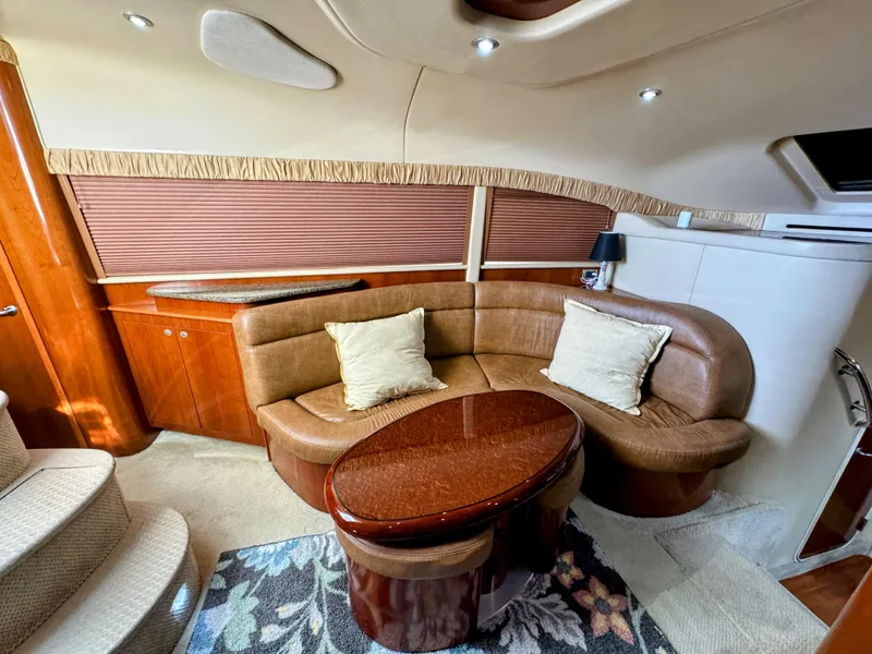 Slide: The Image of Luxurious 2005 Sea Ray 390 Motor Yacht interior with plush seating and elegant wood finishes. - 34