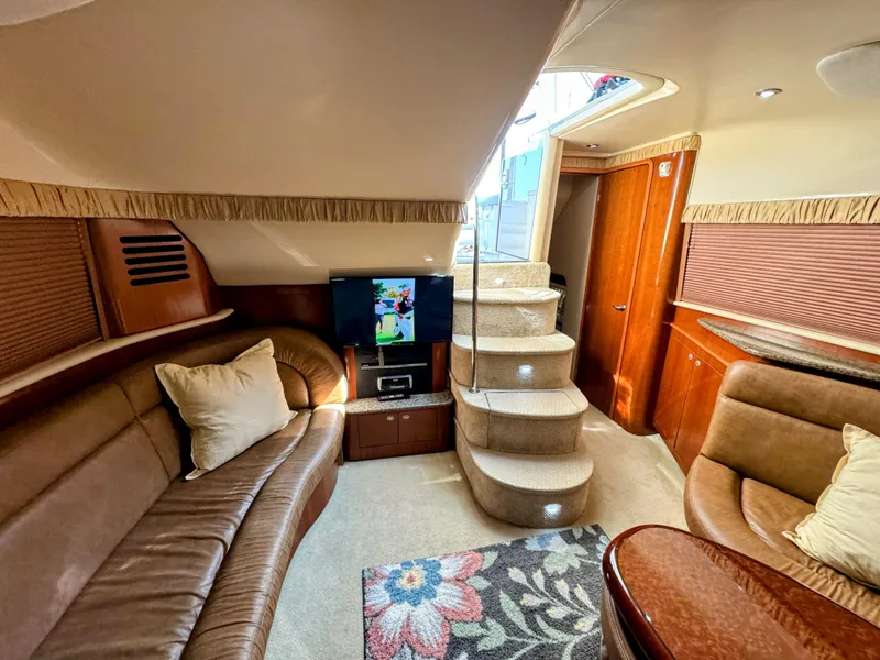 Slide: The Image of Luxurious interior of 2005 Sea Ray 390 Motor Yacht with plush seating and entertainment system. - 35
