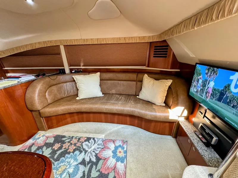 Slide: The Image of Luxurious 2005 Sea Ray 390 Motor Yacht interior with leather seating and TV. - 36