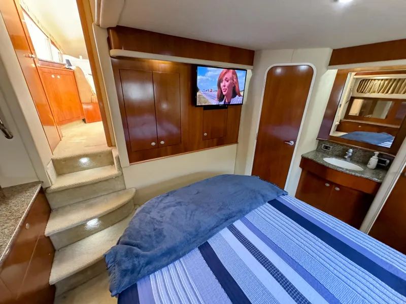 Slide: The Image of Luxurious 2005 Sea Ray 390 Motor Yacht interior with cozy bedroom and modern amenities. - 41