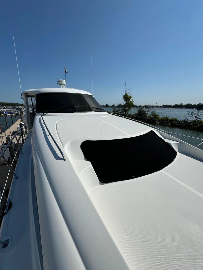 Slide: The Image of 2005 Sea Ray 390 Motor Yacht on a sunny day by the water. - 7