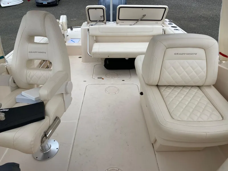 Slide: The Image of 2022 Grady-White Freedom 235 boat interior with luxurious seating and modern design. - 15