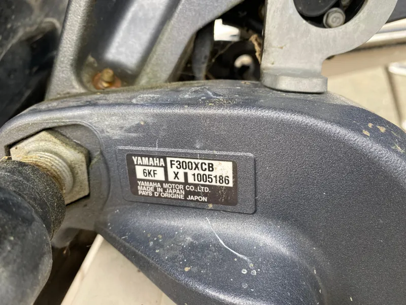 Slide: The Image of Close-up of Yamaha F300XCB engine part on 2022 Grady-White Freedom 235 boat. - 17