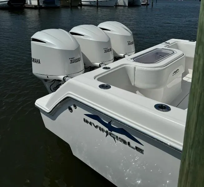 Slide: The Image of 2019 Invincible 36 Open Fisherman boat with triple Yamaha 300 engines docked. - 10