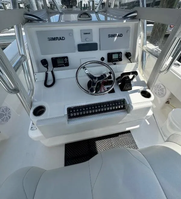 Slide: The Image of 2019 Invincible 36 Open Fisherman helm with Simrad electronics and steering wheel. - 15