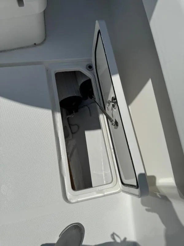 Slide: The Image of Open storage compartment on 2019 Invincible 36 Open Fisherman boat. - 21