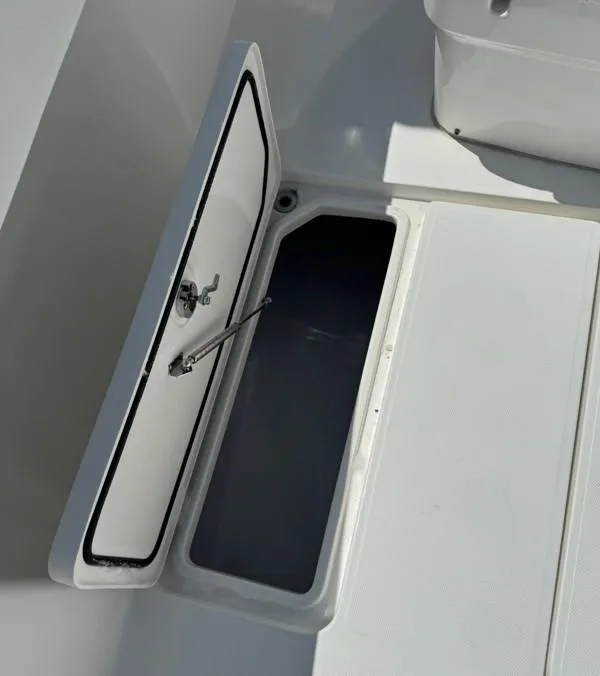 Slide: The Image of Open storage compartment on 2019 Invincible 36 Open Fisherman boat. - 22