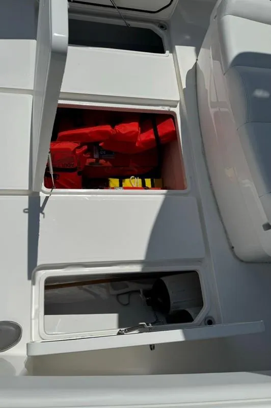 Slide: The Image of 2019 Invincible 36 Open Fisherman boat storage compartments with safety gear. - 23