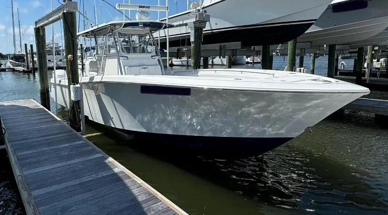 Slide: The Image of 2019 Invincible 36 Open Fisherman docked at marina, side view. - 4