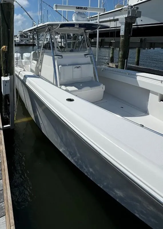 Slide: The Image of 2019 Invincible 36 Open Fisherman boat docked at marina. - 8
