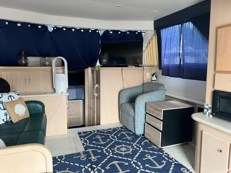 Slide: The Image of Interior of 1999 Carver 370 Voyager yacht with nautical decor and modern amenities. - 15