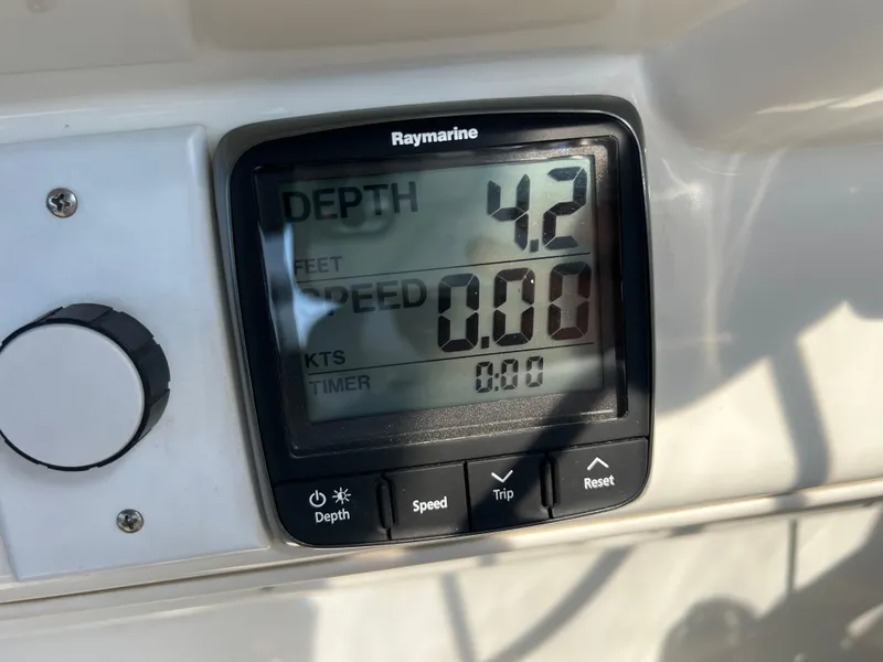 Slide: The Image of Raymarine depth gauge on 1999 Carver 370 Voyager, showing 4.2 feet depth. - 9