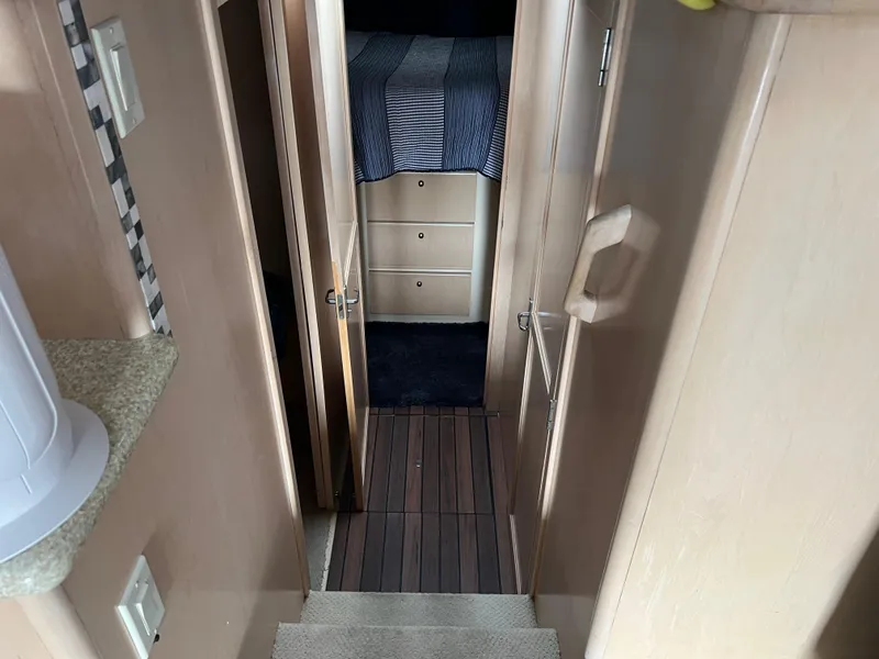 Slide: The Image of Interior view of 1999 Carver 370 Voyager cabin hallway with wood flooring. - 17