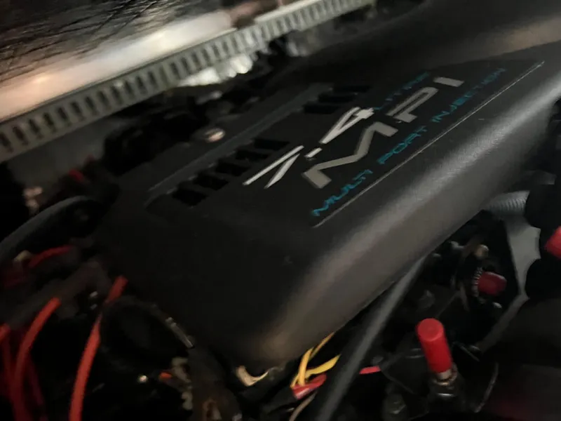 Slide: The Image of Close-up of 1999 Carver 370 Voyager engine, showcasing 7.4L MPI details. - 21