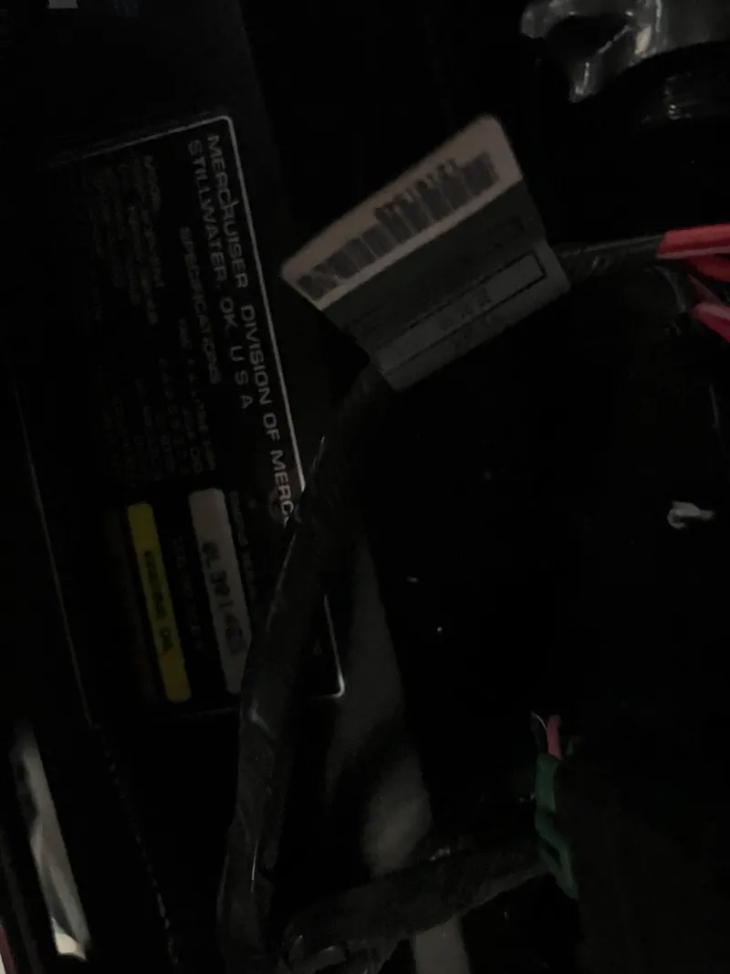 Slide: The Image of Close-up of a 1999 Carver 370 Voyager engine compartment with labels and wiring. - 22