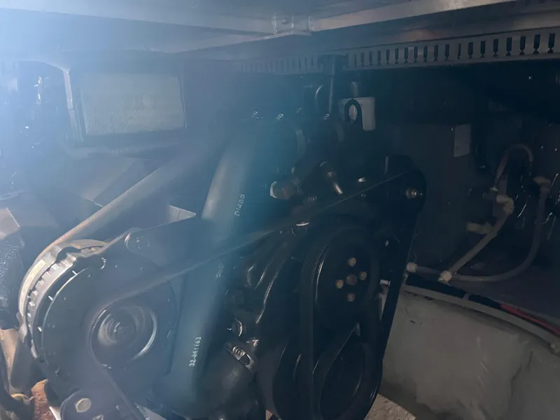 Slide: The Image of Engine compartment of 1999 Carver 370 Voyager boat, showcasing mechanical components. - 26