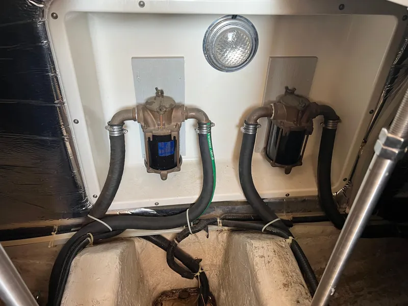 Slide: The Image of 1999 Carver 370 Voyager engine compartment with hoses and fittings. - 27