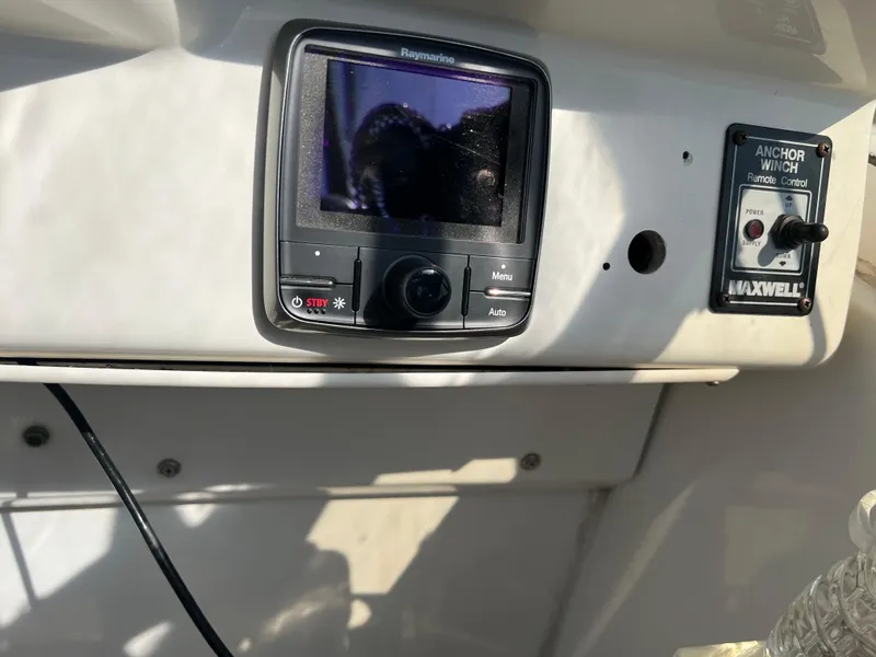 Slide: The Image of 1999 Carver 370 Voyager dashboard with Raymarine display and Maxwell anchor control. - 8