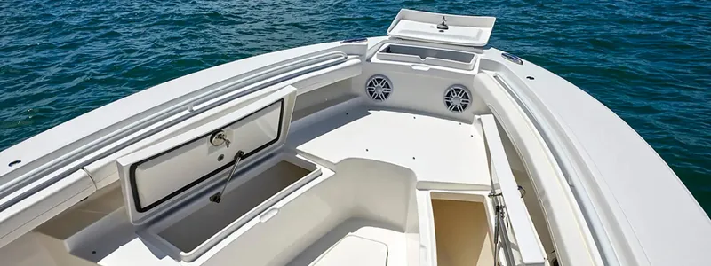 Slide: The Image of 2026 Regulator 23 boat interior with open storage compartments and speakers on the deck. - 7