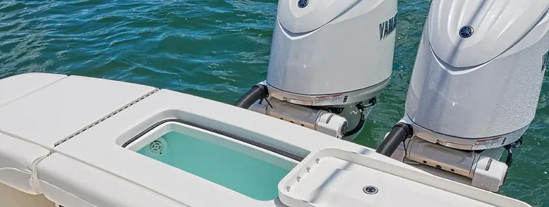 Slide: The Image of 2026 Regulator 23 boat with dual outboard motors on water. - 11