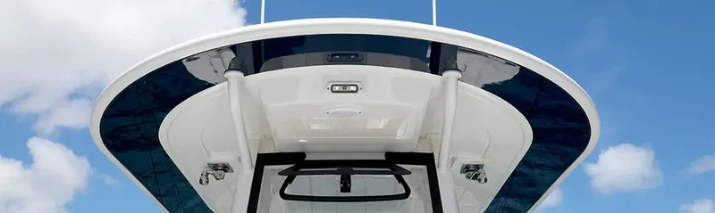 Slide: The Image of 2026 Regulator 23 boat top view against blue sky. - 12
