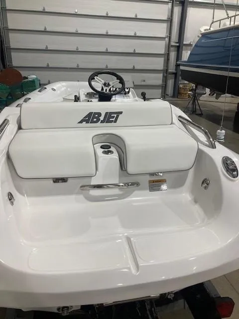 Slide: The Image of 2023 AB Inflatables ABJET 350XP boat in a garage, rear view. - 3
