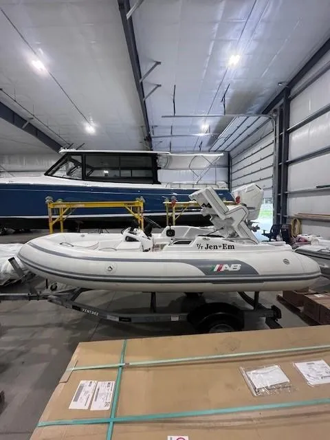Slide: The Image of 2023 AB Inflatables ABJET 350XP boat in a storage facility. - 4