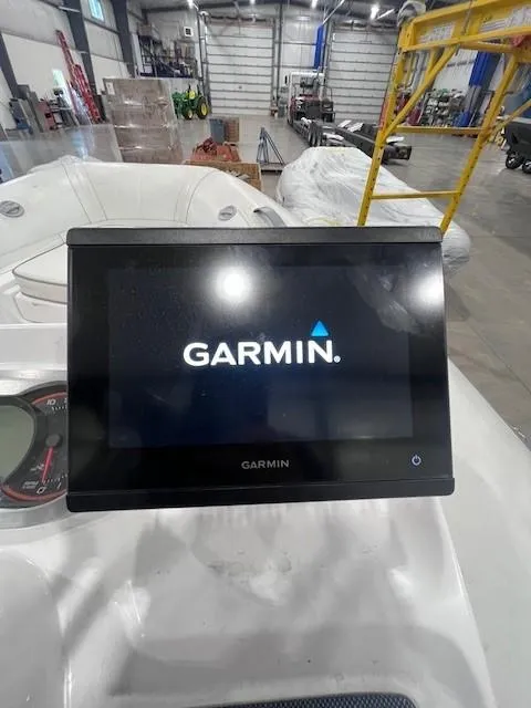 Slide: The Image of Garmin display on 2023 AB Inflatables ABJET 350XP in a workshop setting. - 6